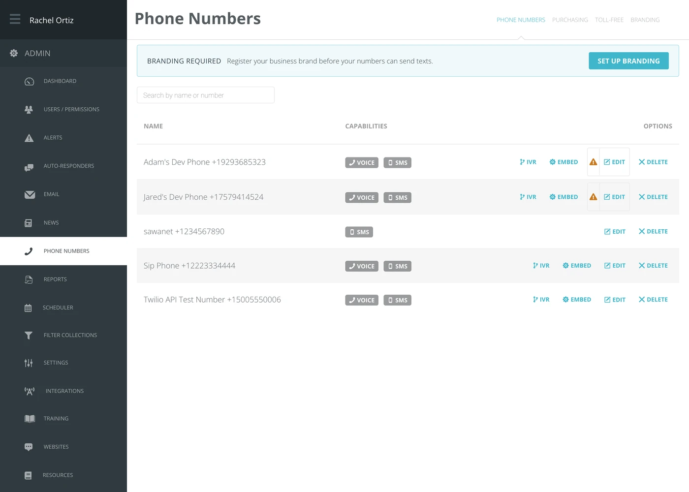 The Phone Numbers screen, listing each number with Voice and SMS capability badges and per-row options.